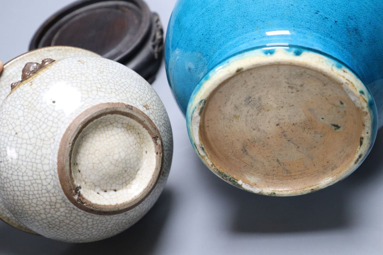 A 19th century Chinese crackleglaze squat bowl, with mask handles and a 19th century Chinese turquoise glazed baluster vase and two